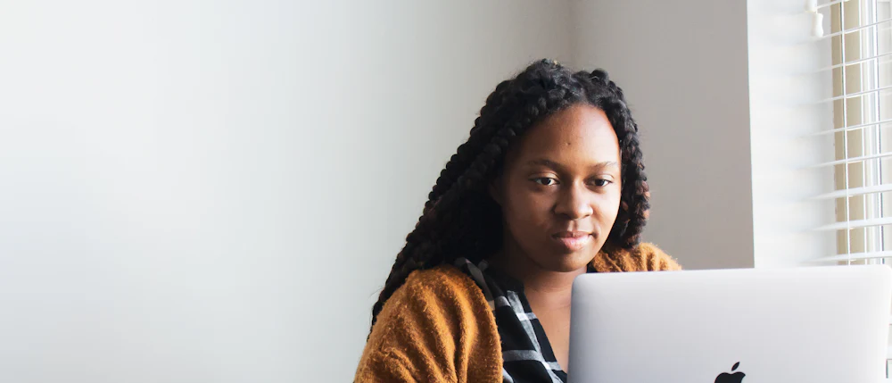 A person working through material on a laptop
